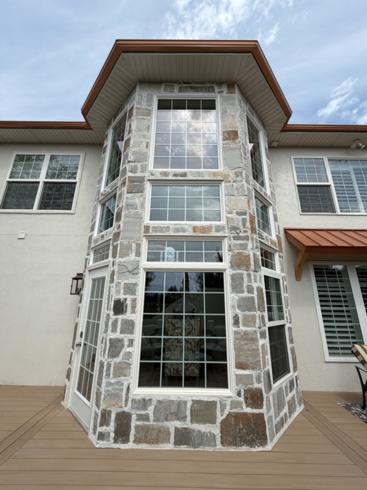 Clean multi-panel bay window on a residential home